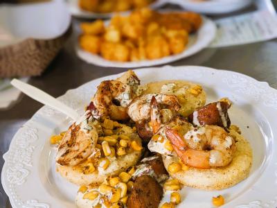 Enjoy the flavors of summer with our deconstructed Shrimp Boil! Fresh shrimp, roasted corn, andouille sausage, baby red potatoes & lemons tossed in our  