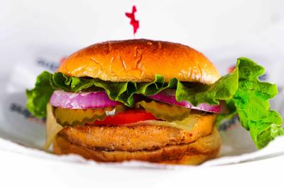 The Turkey Burger is served on a toasted and buttered brioche bun with melted Cheddar cheese.  The vegetables are from the local farmers market and include red onion, lettuce, tomatoes and pickles topped with ketchup, mustard, mayo and our specialty house